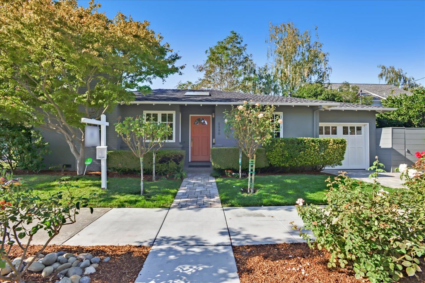 front view of a house with a yard