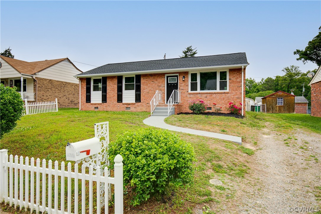 a front view of a house with a yard table and chairs