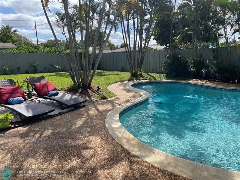 a view of a backyard with a patio