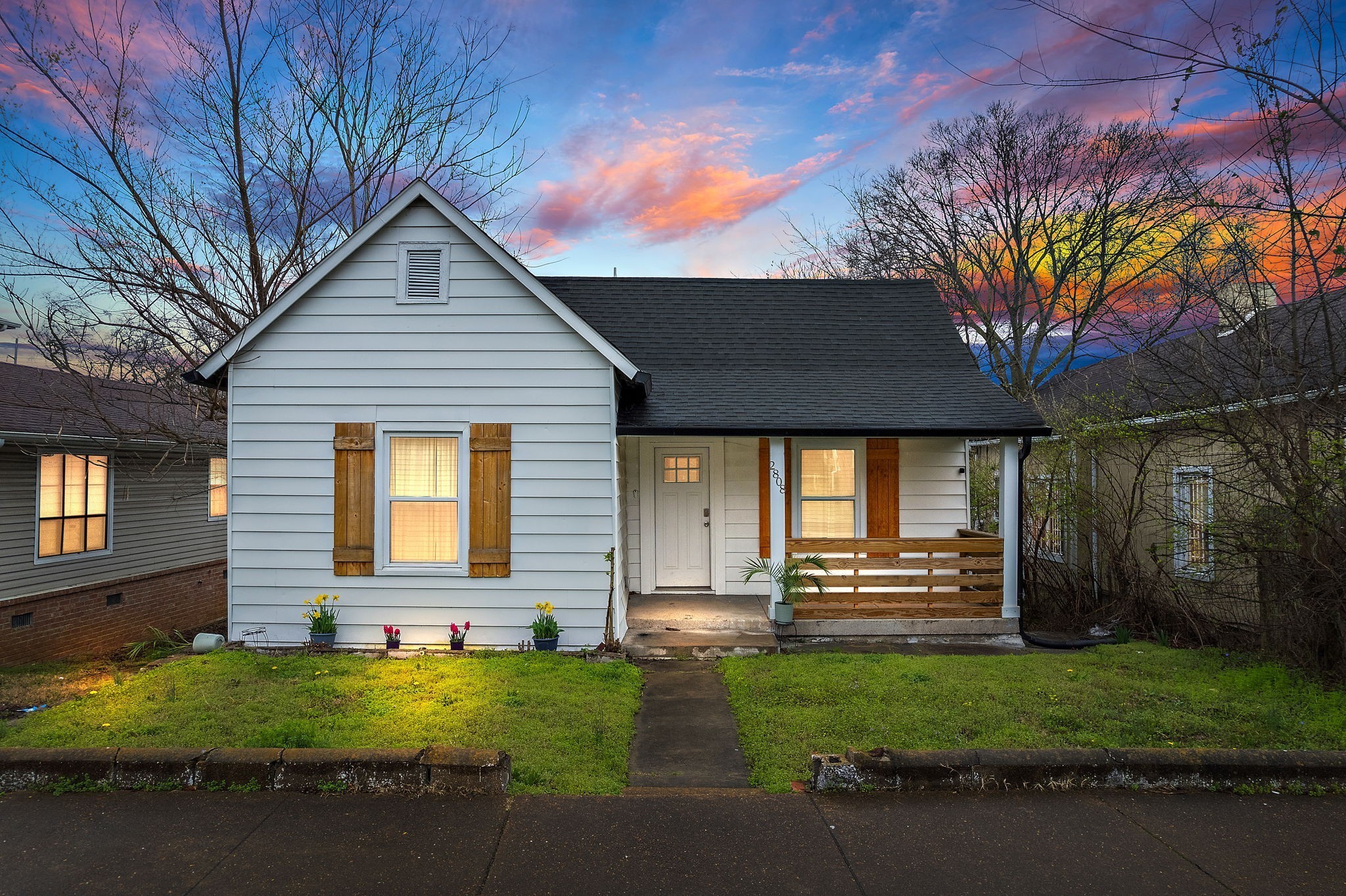 a front view of a house with garden