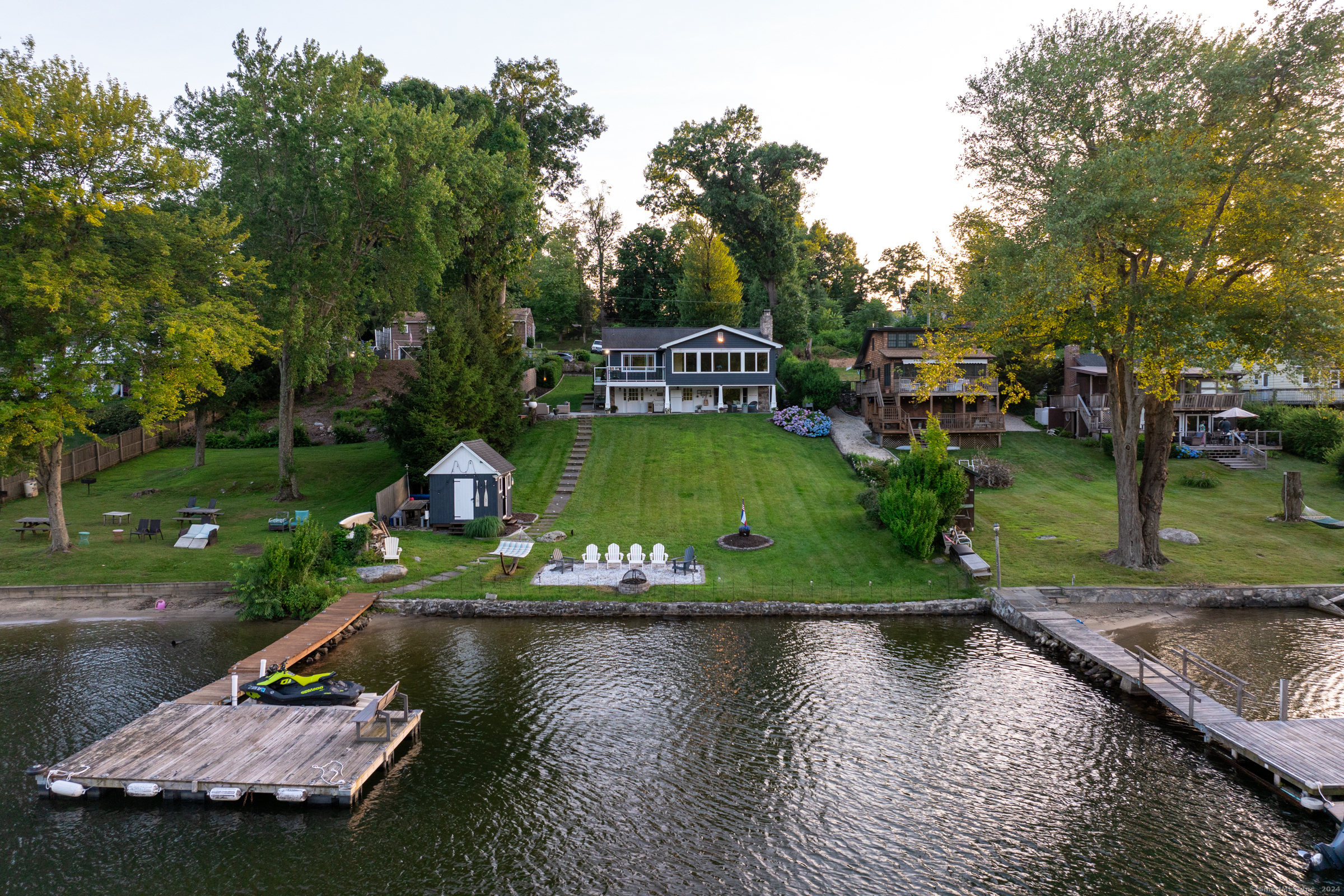 an aerial view of a house with a yard