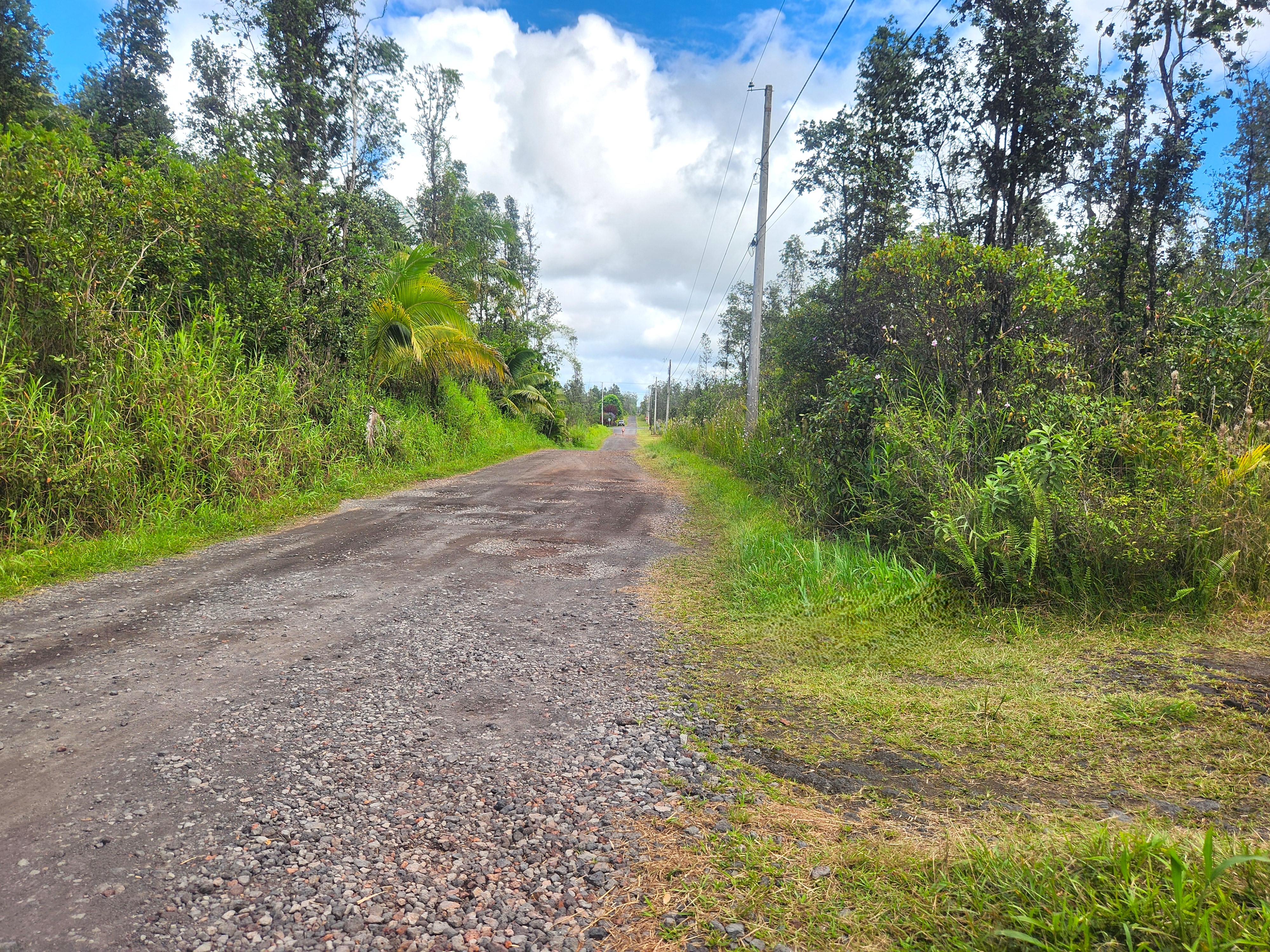 View of 39th Ave with the driveway visible on the right. Orchidland Dr is about 1/10th mile from your new address.