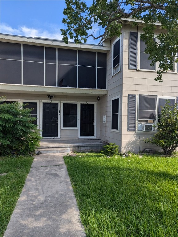 a front view of a house with a yard and porch