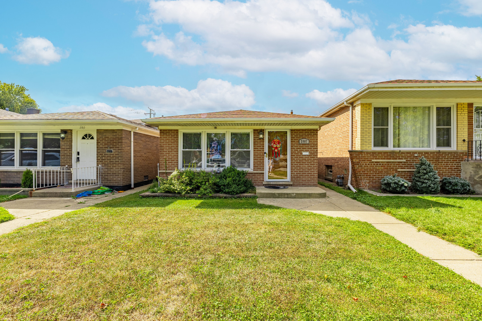 front view of a house with a yard