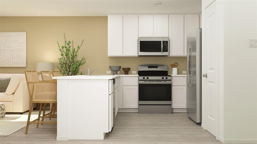 a kitchen with a sink a stove and cabinets