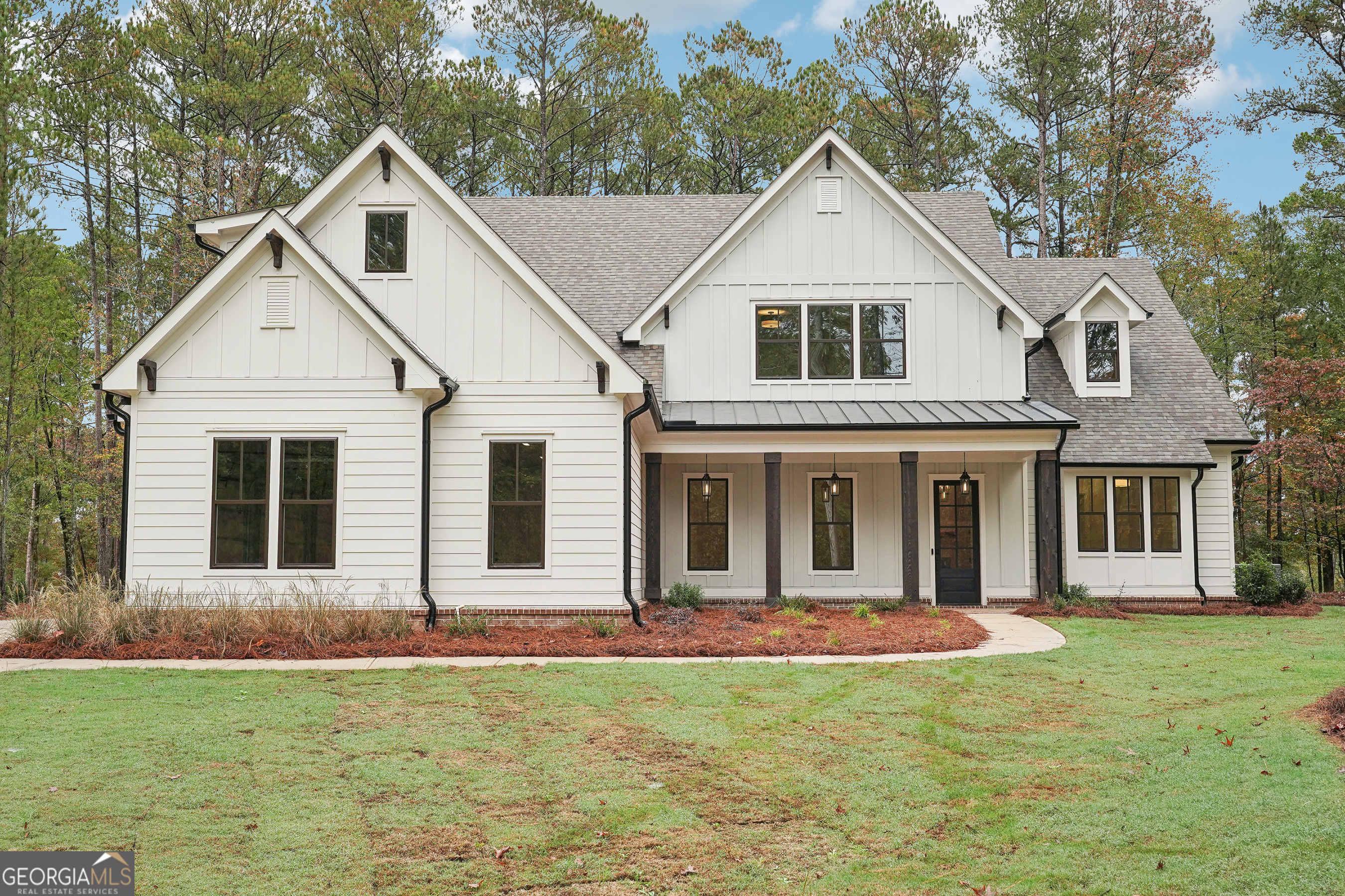 a front view of a house with a yard