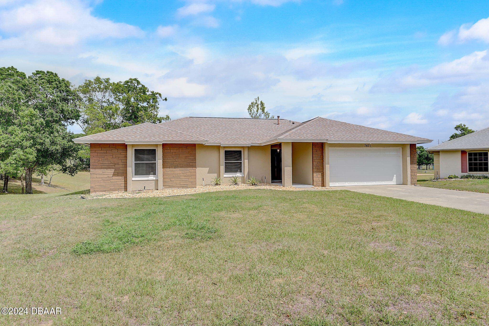 front view of a house with a yard