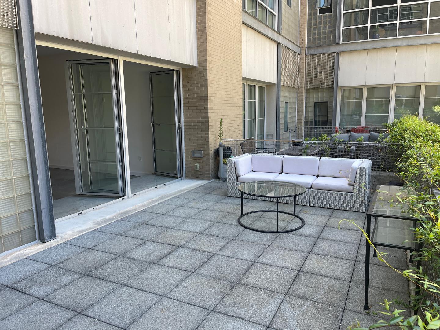 a view of a chairs and table in the porch