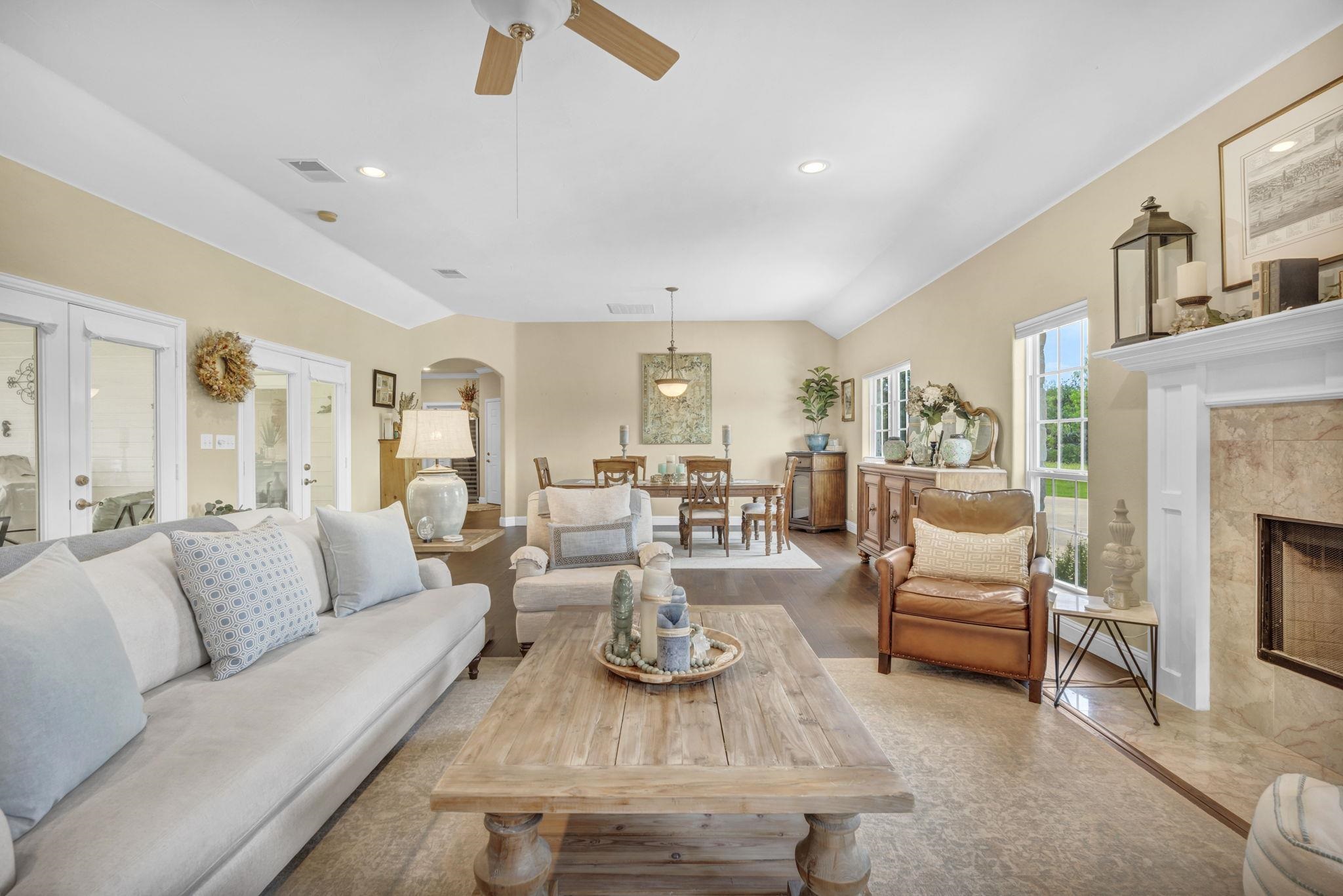 a living room with furniture and a fireplace