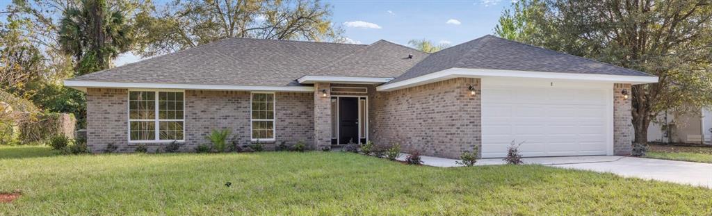 front view of a house with a yard