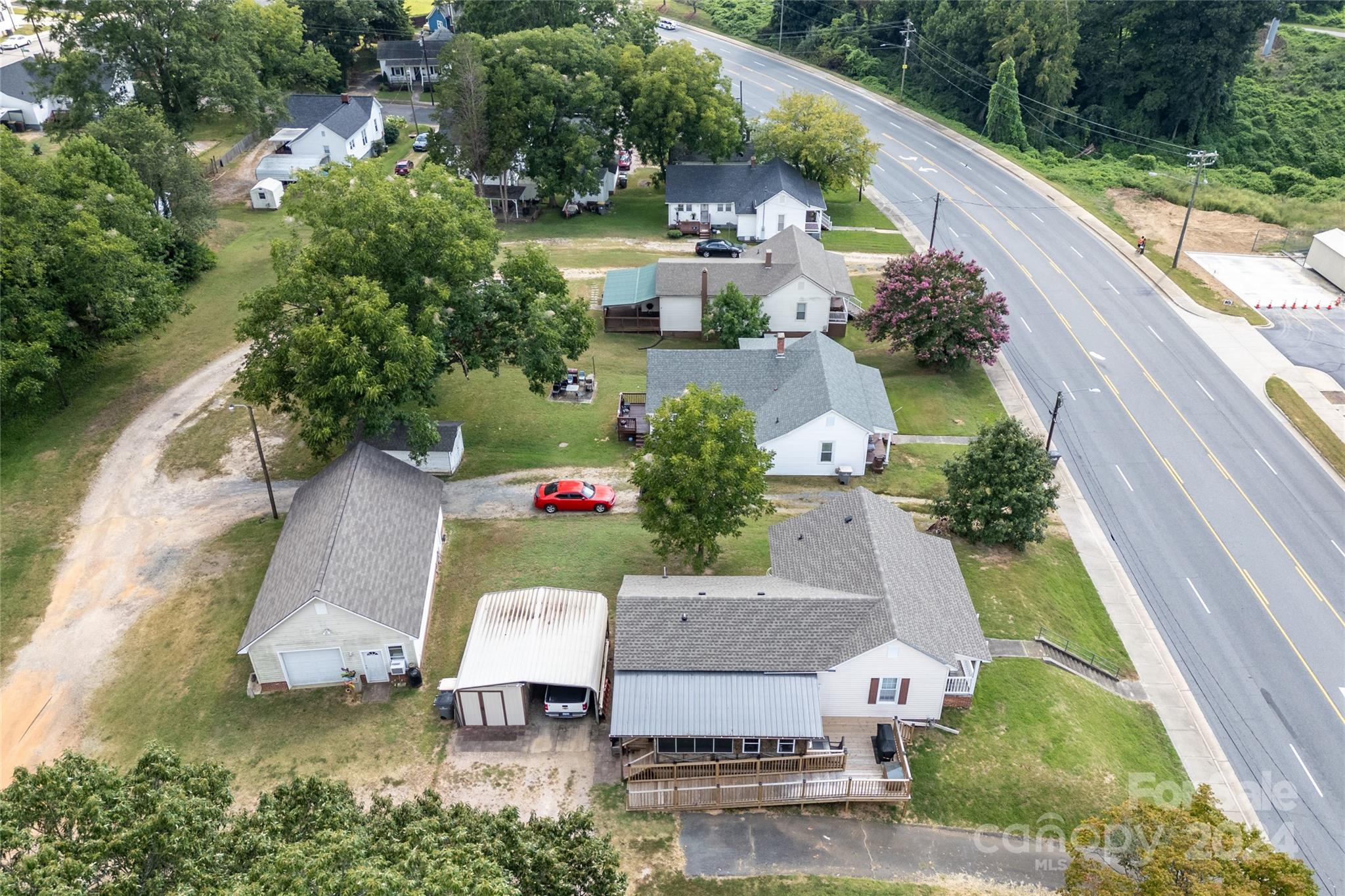 an aerial view of a house with outdoor space