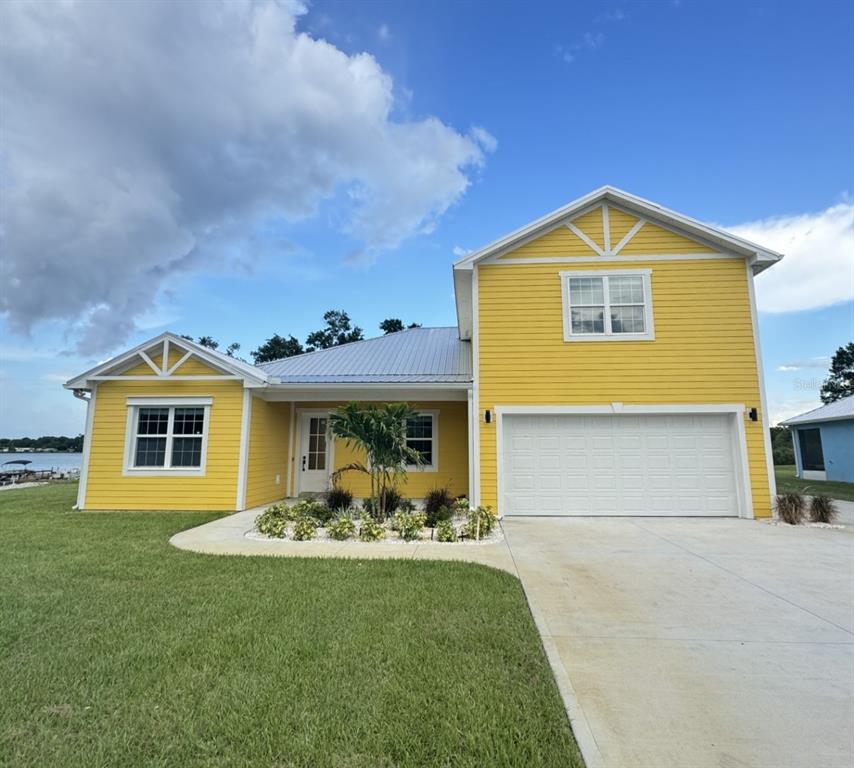 a front view of a house with yard