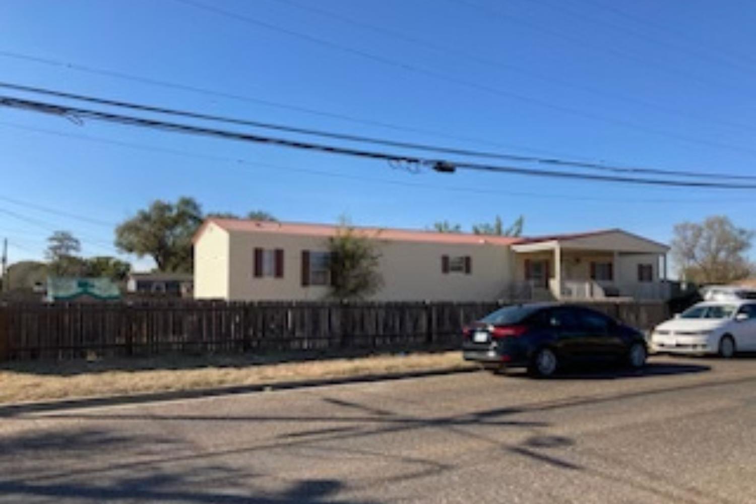 a view of a car parked in front of a house