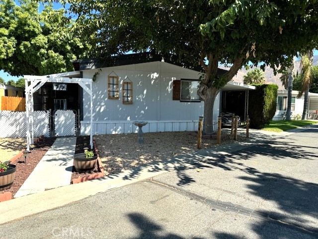 a front view of a house with street view