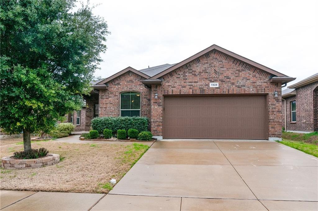 a front view of a house with garage