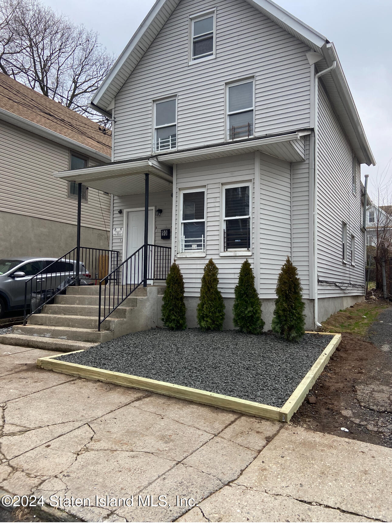 a view of a house with a yard and garage