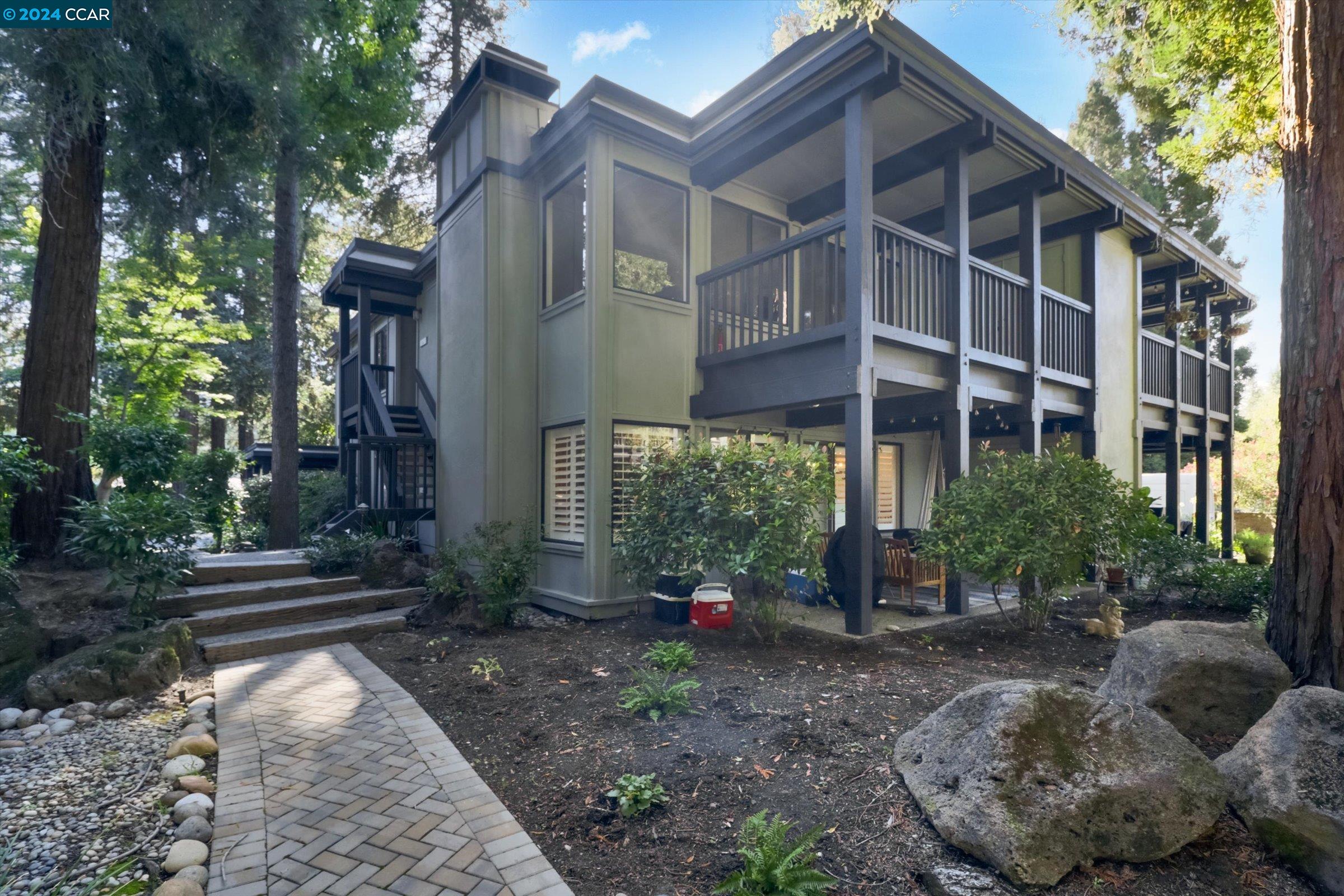 a view of a house with a yard and plants