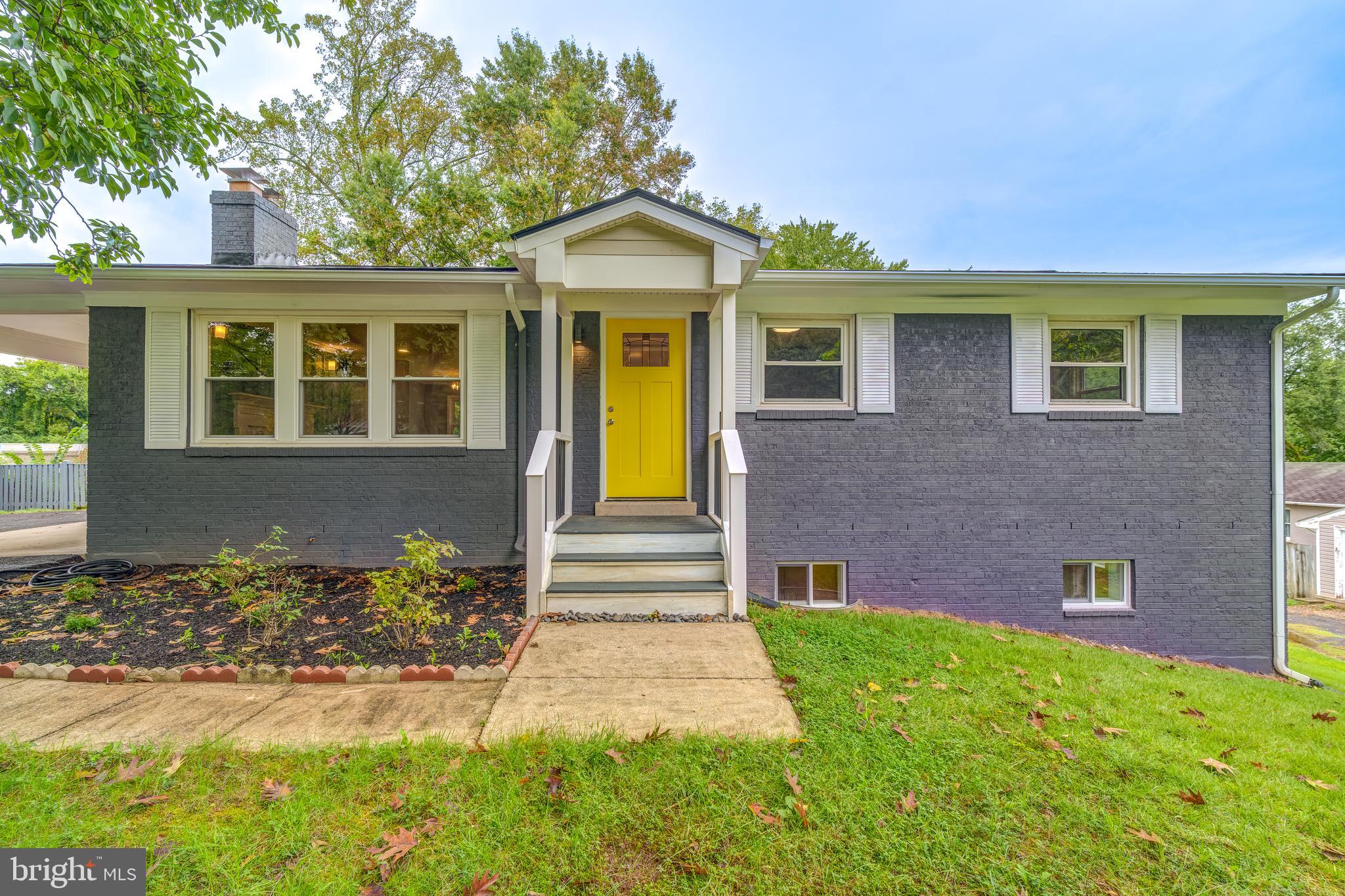 front view of a house with a yard