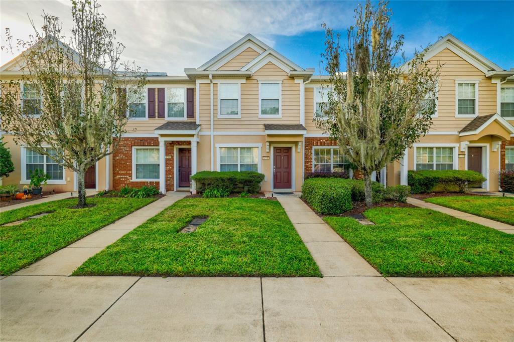 a front view of a house with a yard