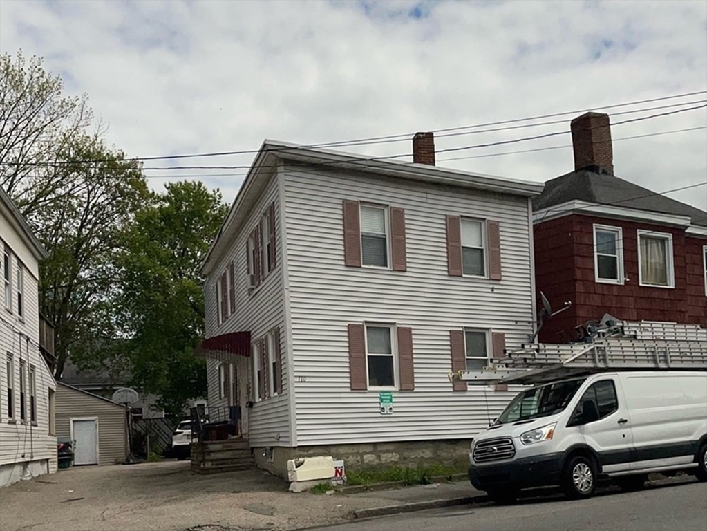 a view of a car parked in front of a house