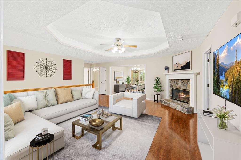 a living room with furniture fireplace and flat screen tv