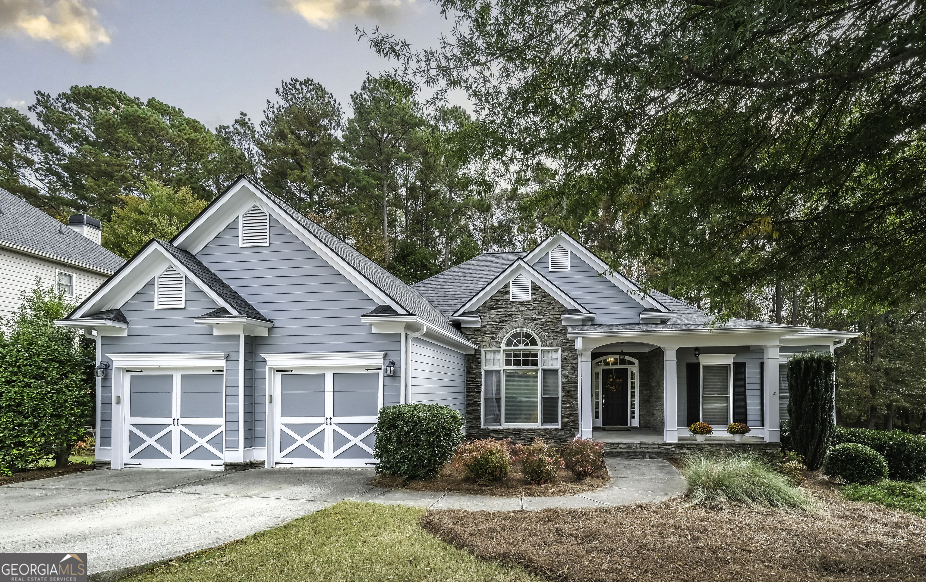 a front view of a house with a yard