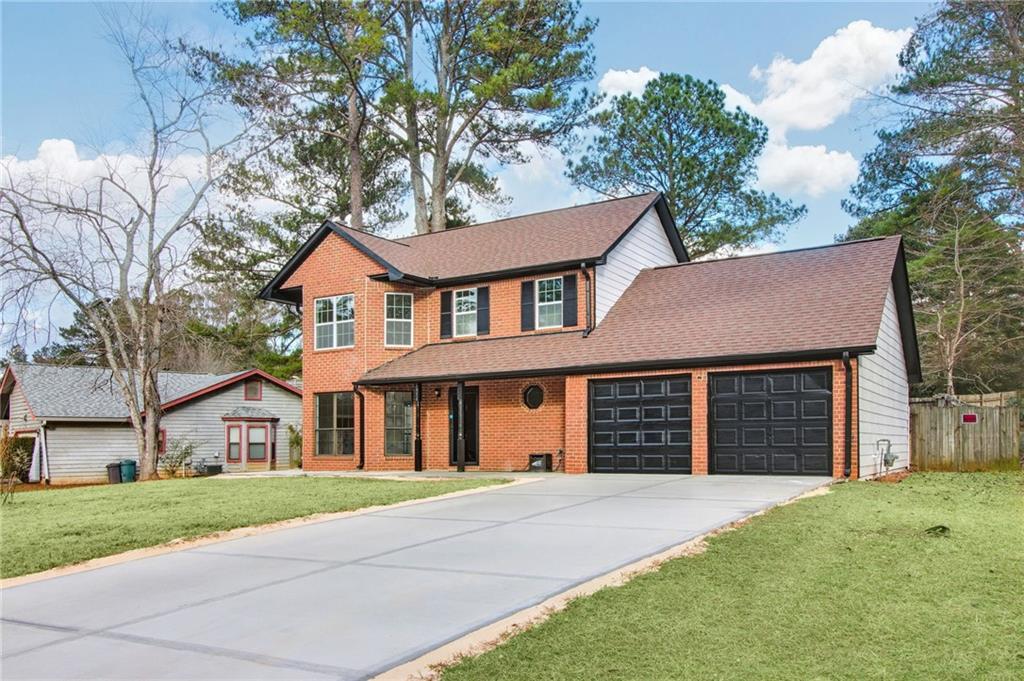 front view of a house with a yard