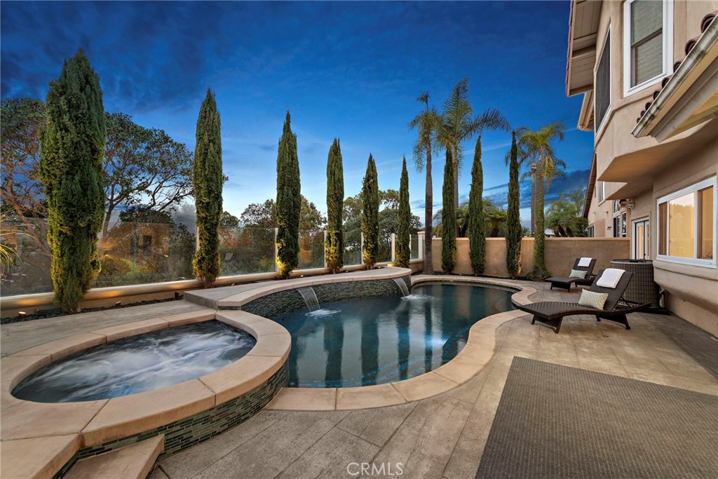 a view of a swimming pool with outdoor seating