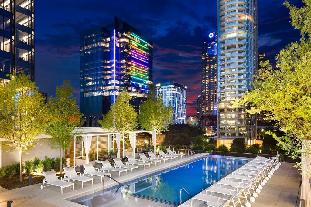 a view of swimming pool with outdoor seating