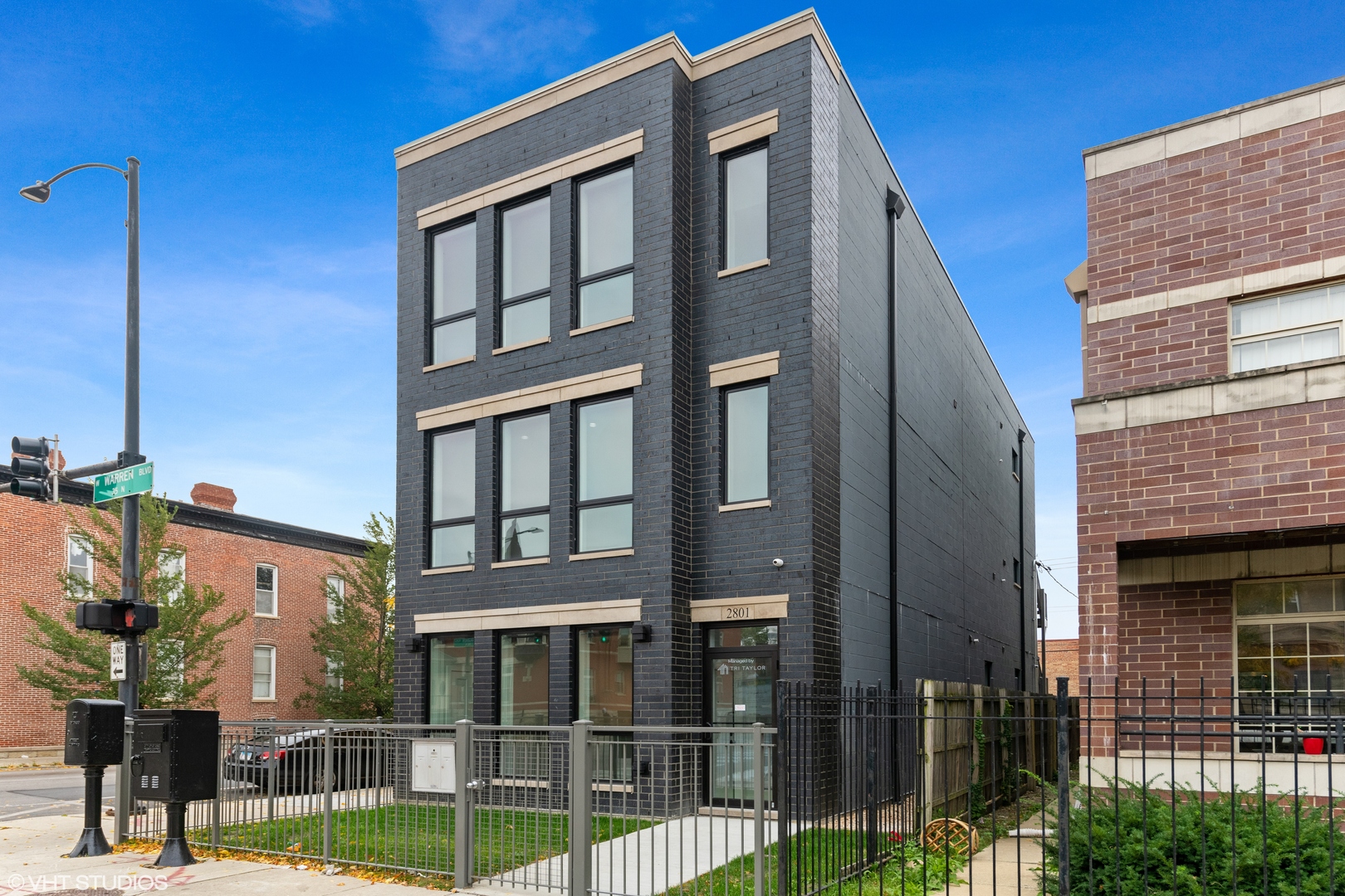 a front view of a building with street view