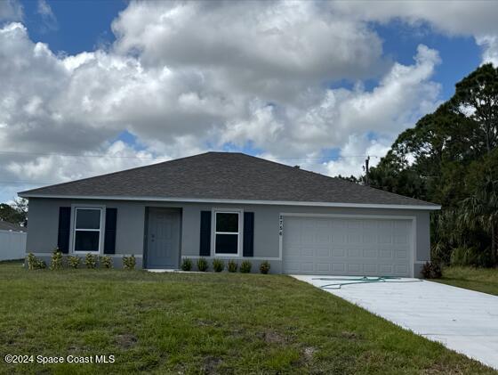 front view of a house with a yard