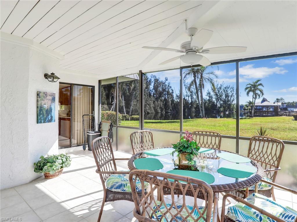 a view of a patio with a table chairs and a garden