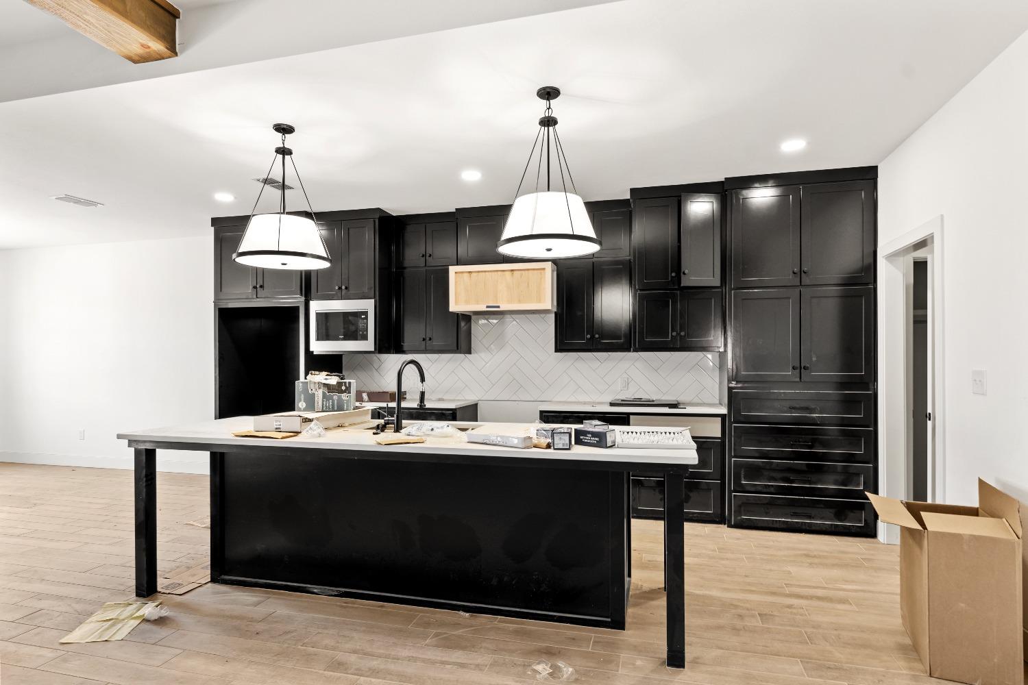 a kitchen with a sink stove and refrigerator