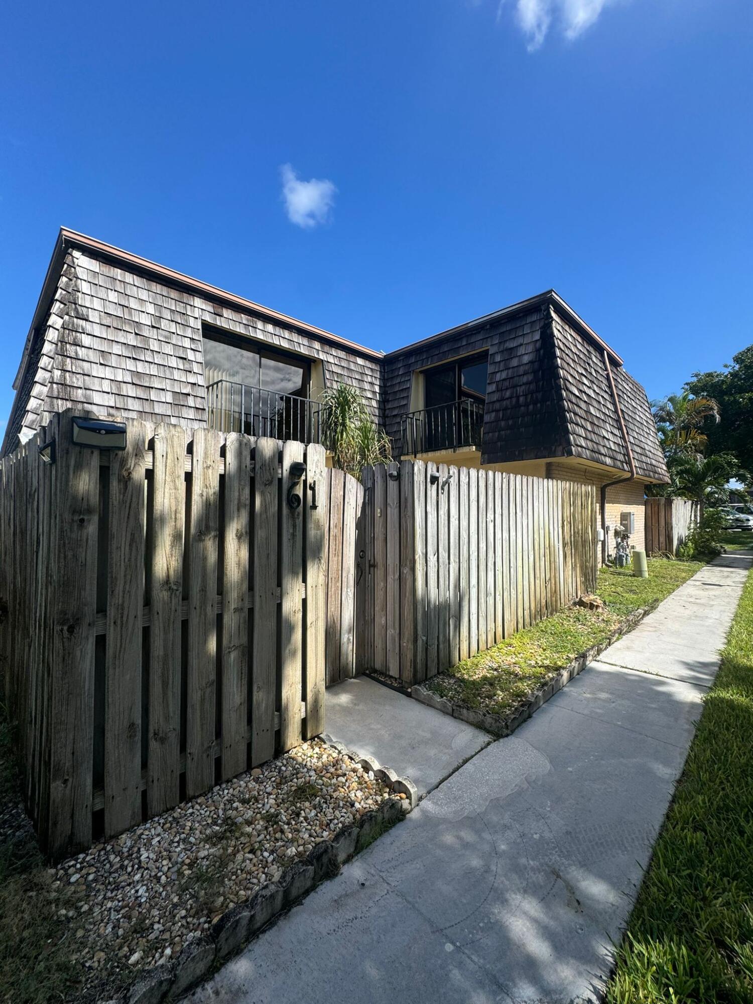 a front view of a house with a outdoor space