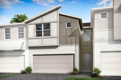 a front view of a house with a garage