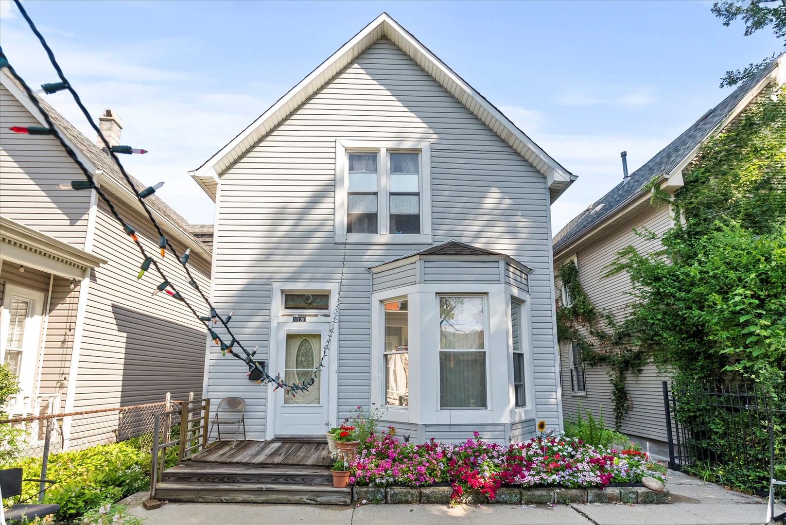 a front view of a house with a garden