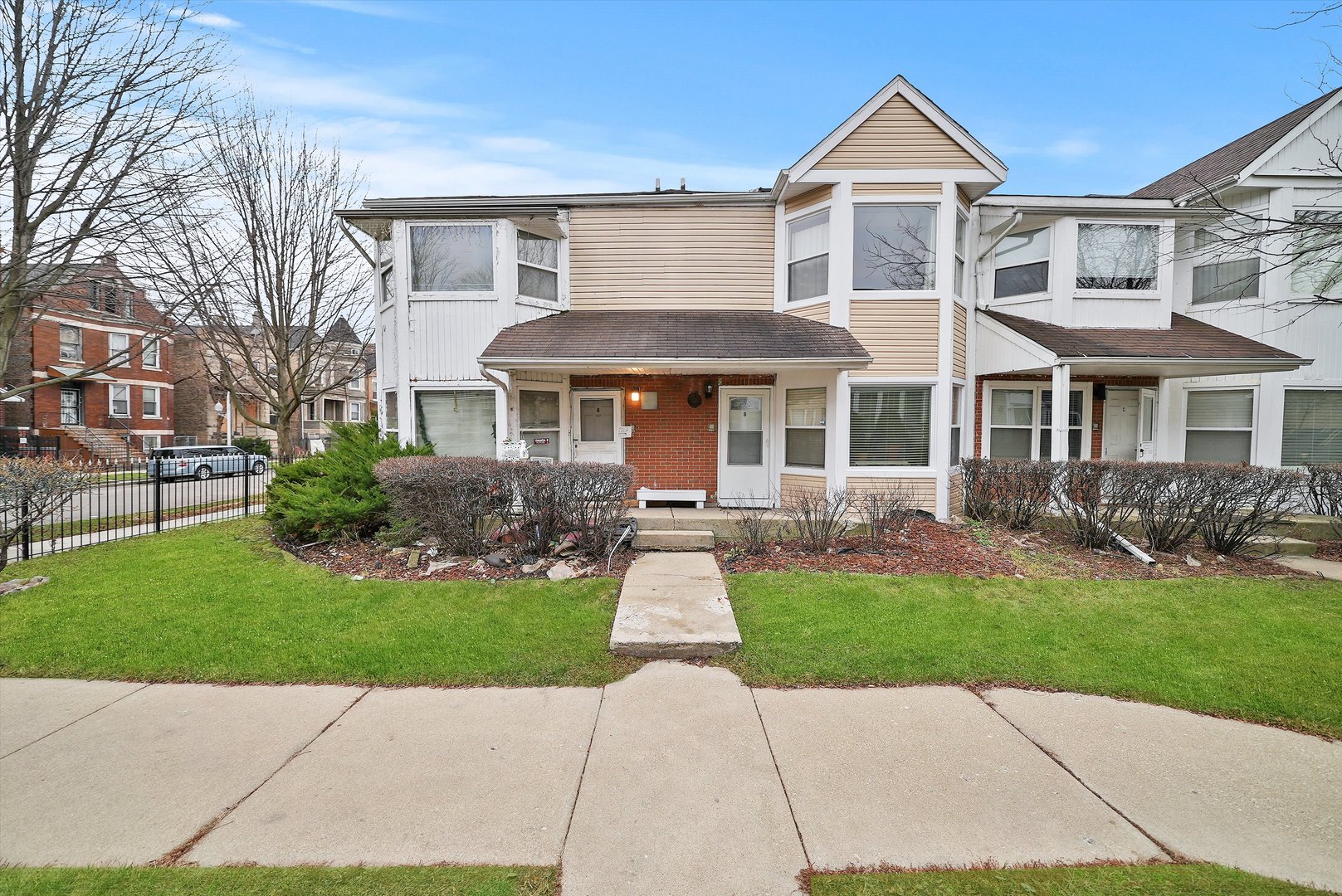 a front view of a house with a yard