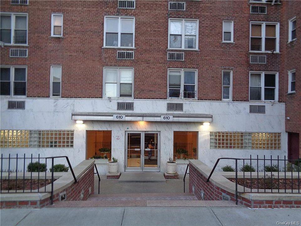 a view of a brick building with many windows