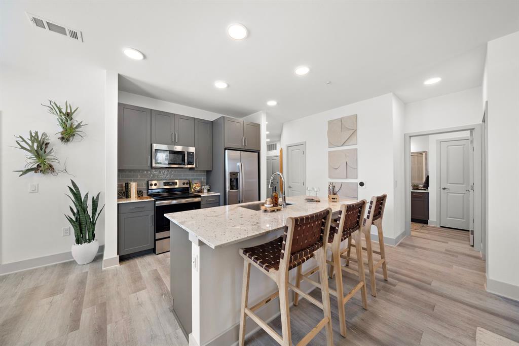 a kitchen with a table and chairs in it