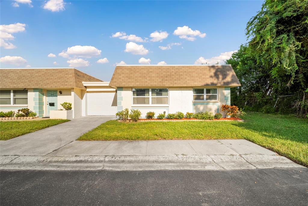 a view of a house with a yard