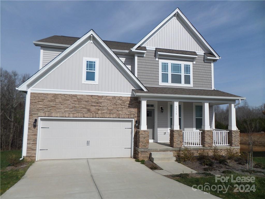 a front view of a house with white walls