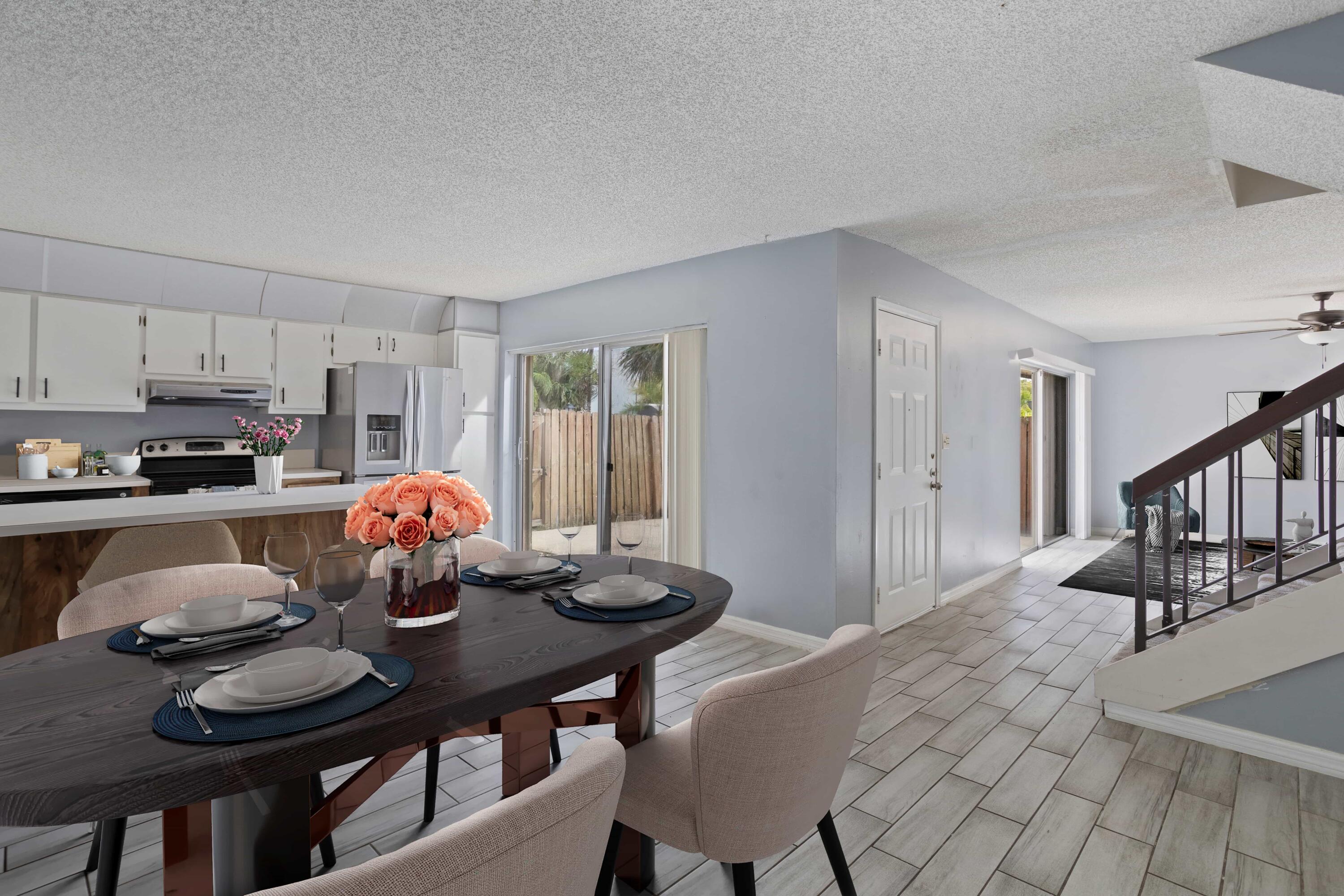 a view of a dining room and livingroom with furniture