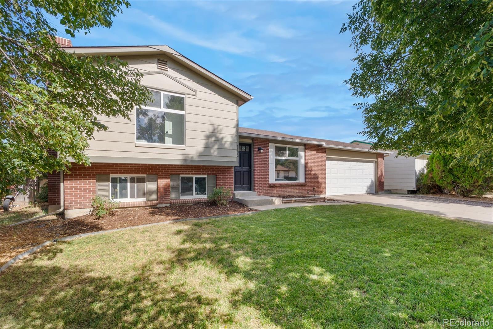 a house view with a garden space