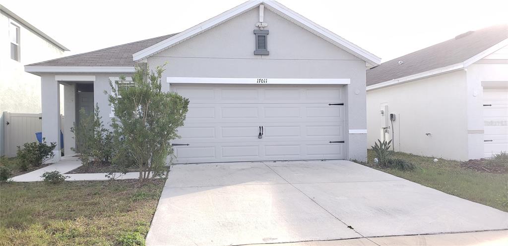 a front view of a house with garage