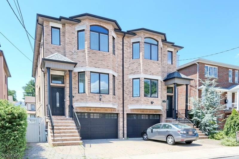 a car parked in front of a brick house