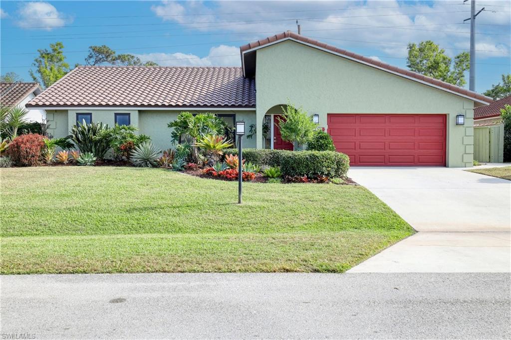 Concrete block home with NEW ANDERSON HURRICANE WINDOWS