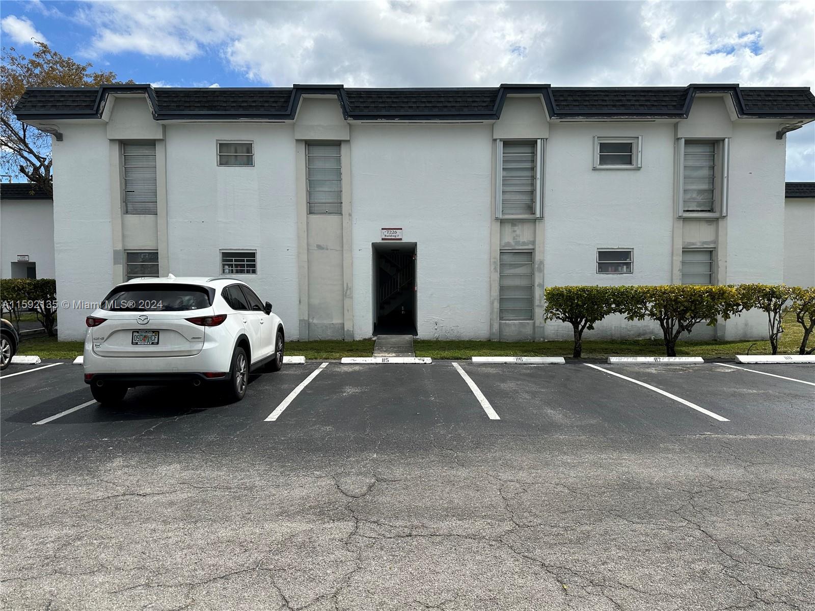 a car parked in front of a house