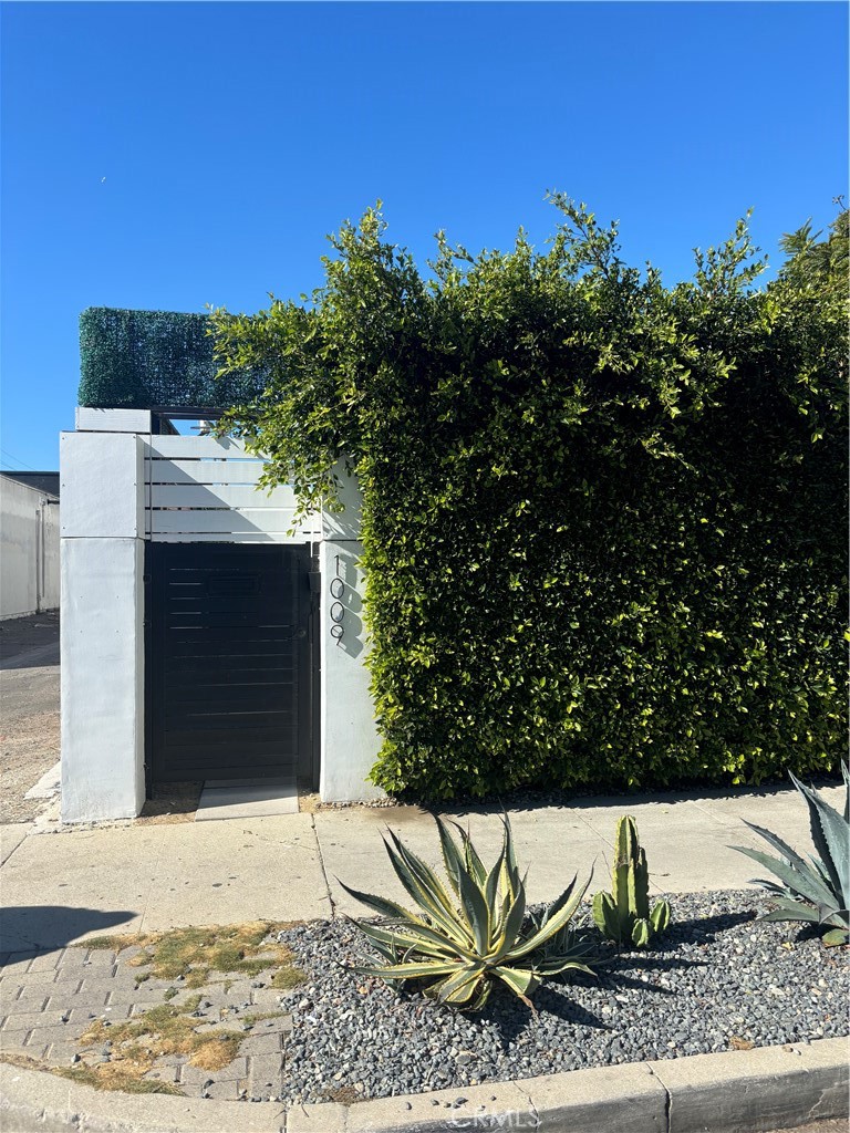 a view of a wooden door and a yard