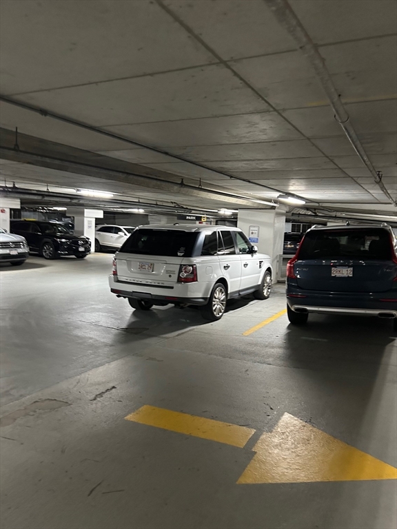 a view of parking garage with cars