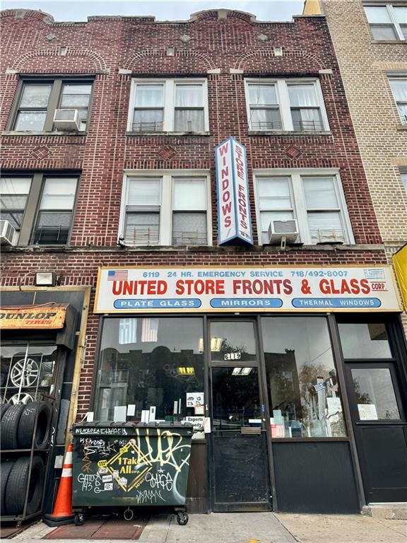 a view of a building with retail shops